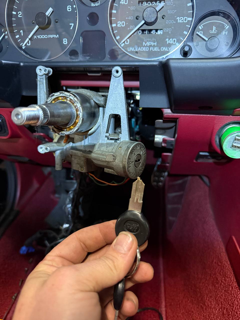 Car locksmith replacing ignition lock cylinder